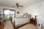 BEDROOM 2 QUEEN SUITE WITH WALKOUT DOORS TO THE BALCONY WITH THOSE FANTASTIC LAKE VIEWS